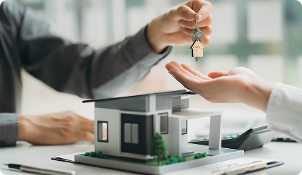 A couple shaking hands with a financial advisor.